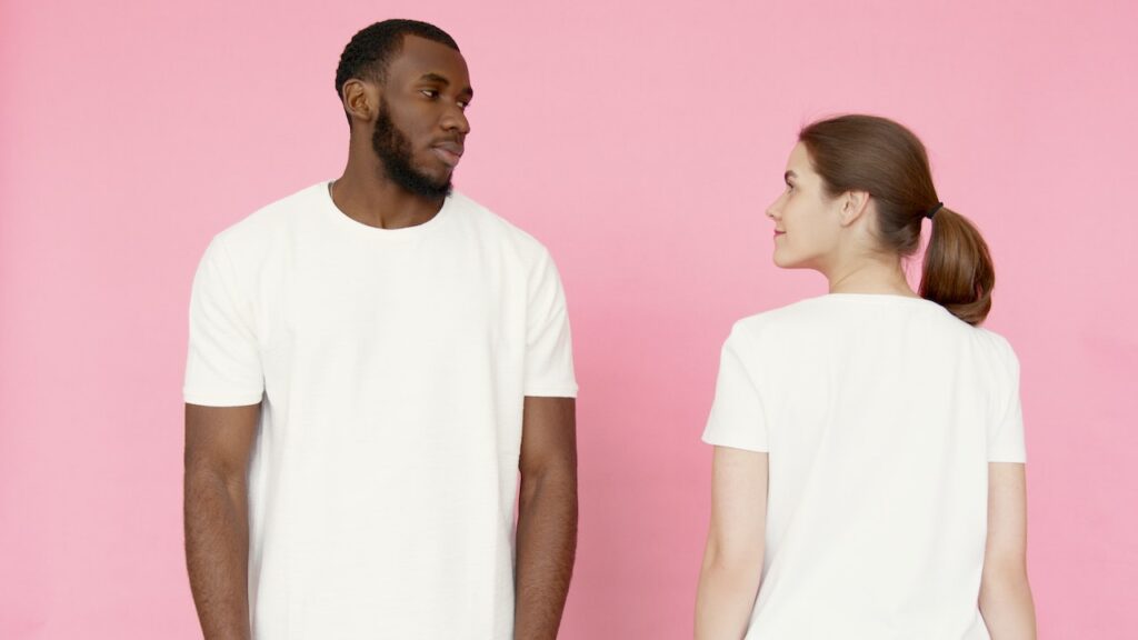Are Cotton T-Shirts the Best? Comfort and Benefits Unraveled 1 men and women wearing a comfortable white cotton t-shirt paired with denim jeans, showcasing the versatility of AirGarb's premium cotton tees. The shirt is breathable, hypoallergenic, and perfect for everyday wear